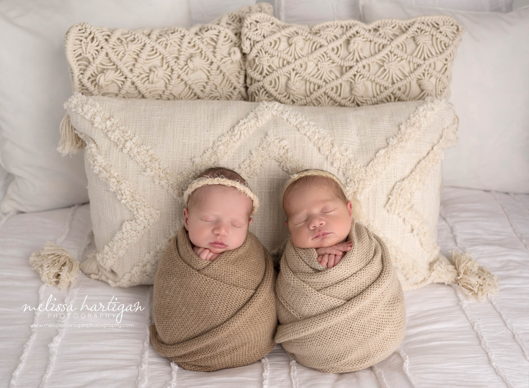 newborn baby girls wrapped neutral colored knitted wraps to match boho theme style newborn pics
