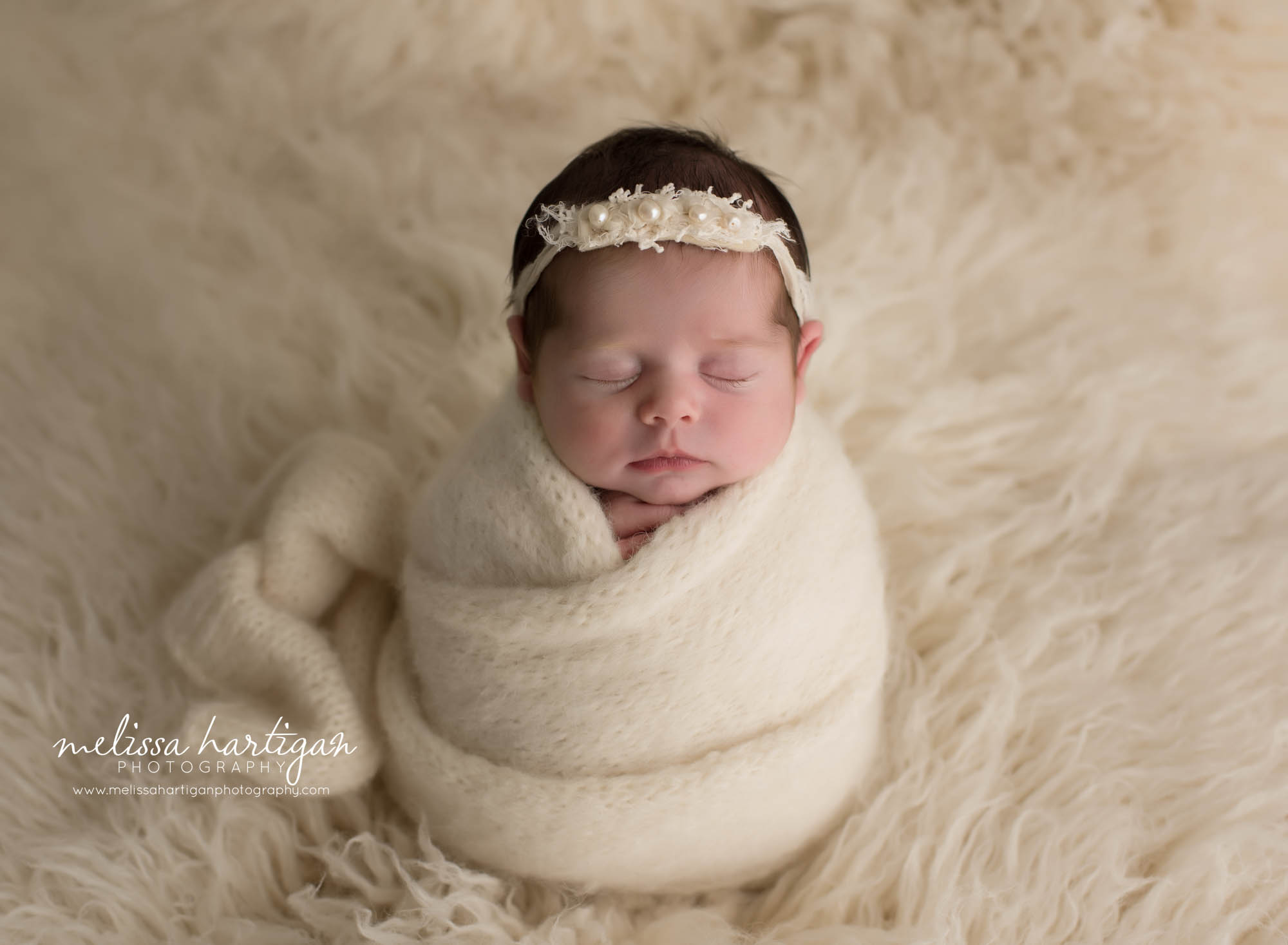 newborn baby girl wrapped in cream knitted wrap CT newborn photographer