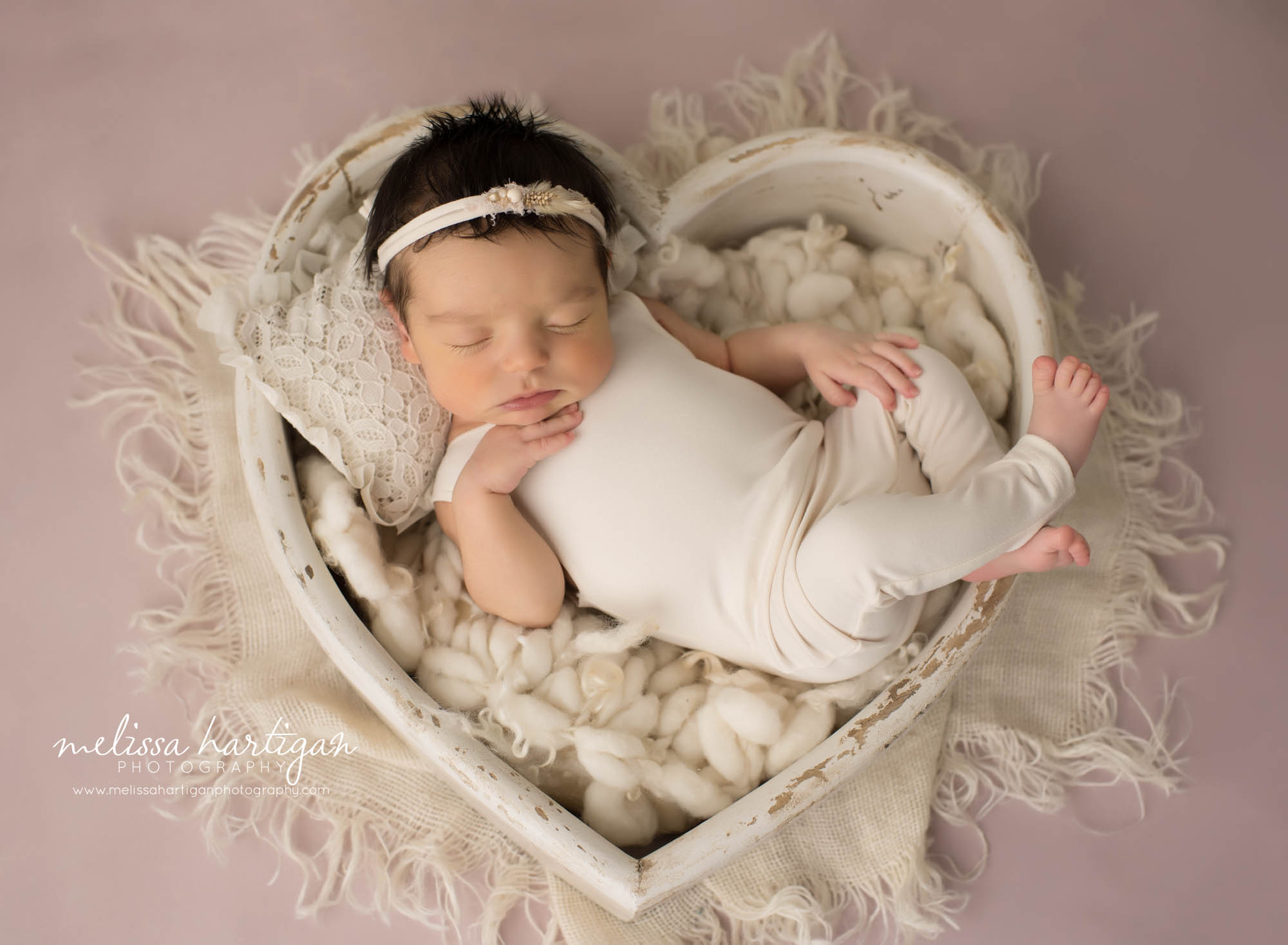 newborn baby girl posed in wooden heart bowl prop newborn photography middletown CT