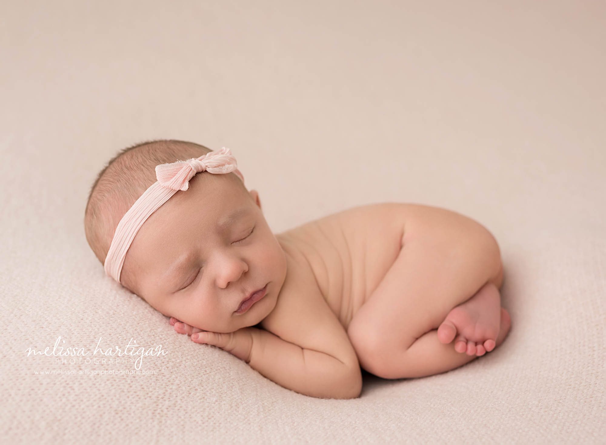 newborn baby girl posed on tummy newborn photography ct