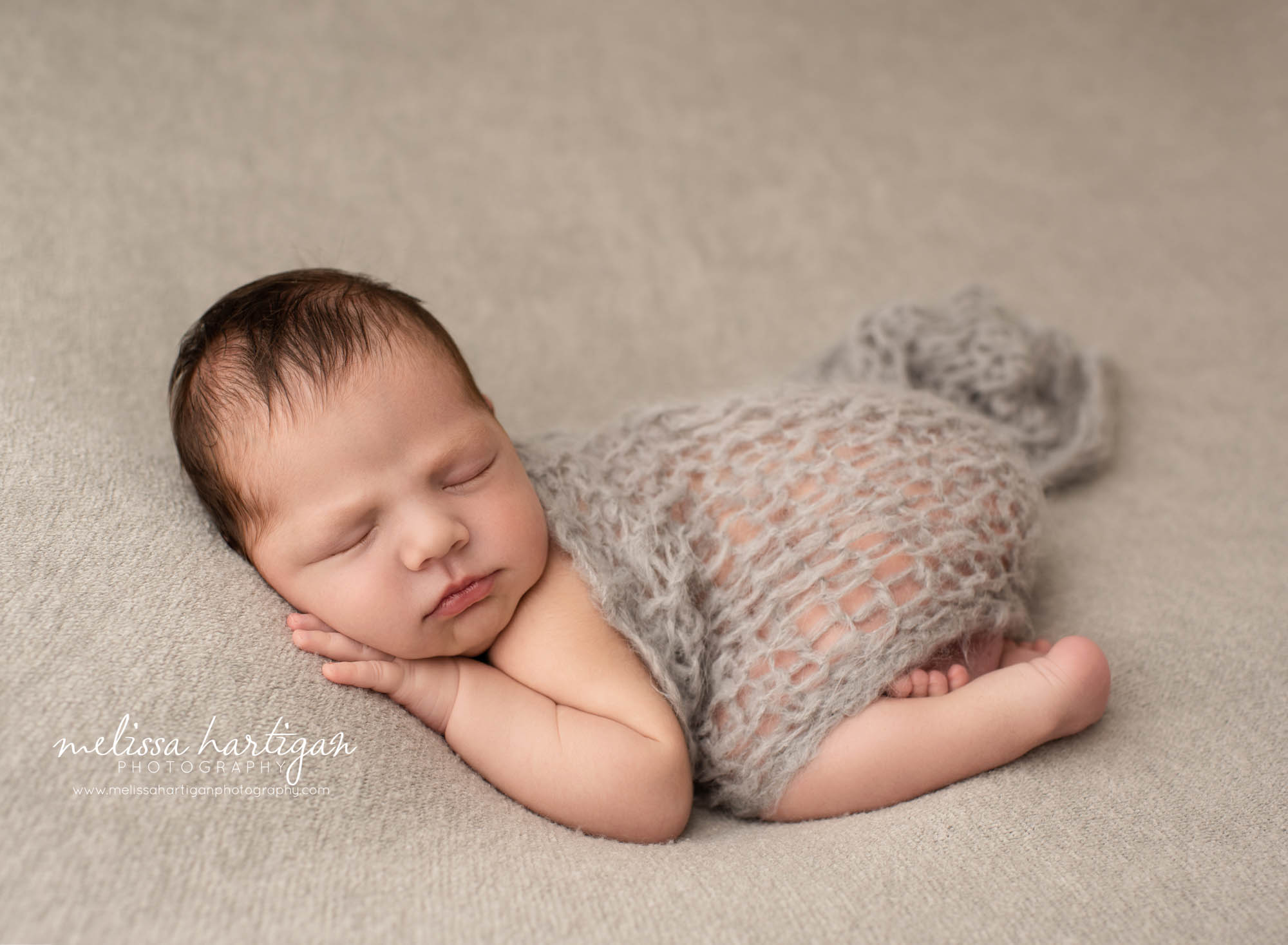 newborn baby boy posed on tummy with draping wrap newborn photography CT