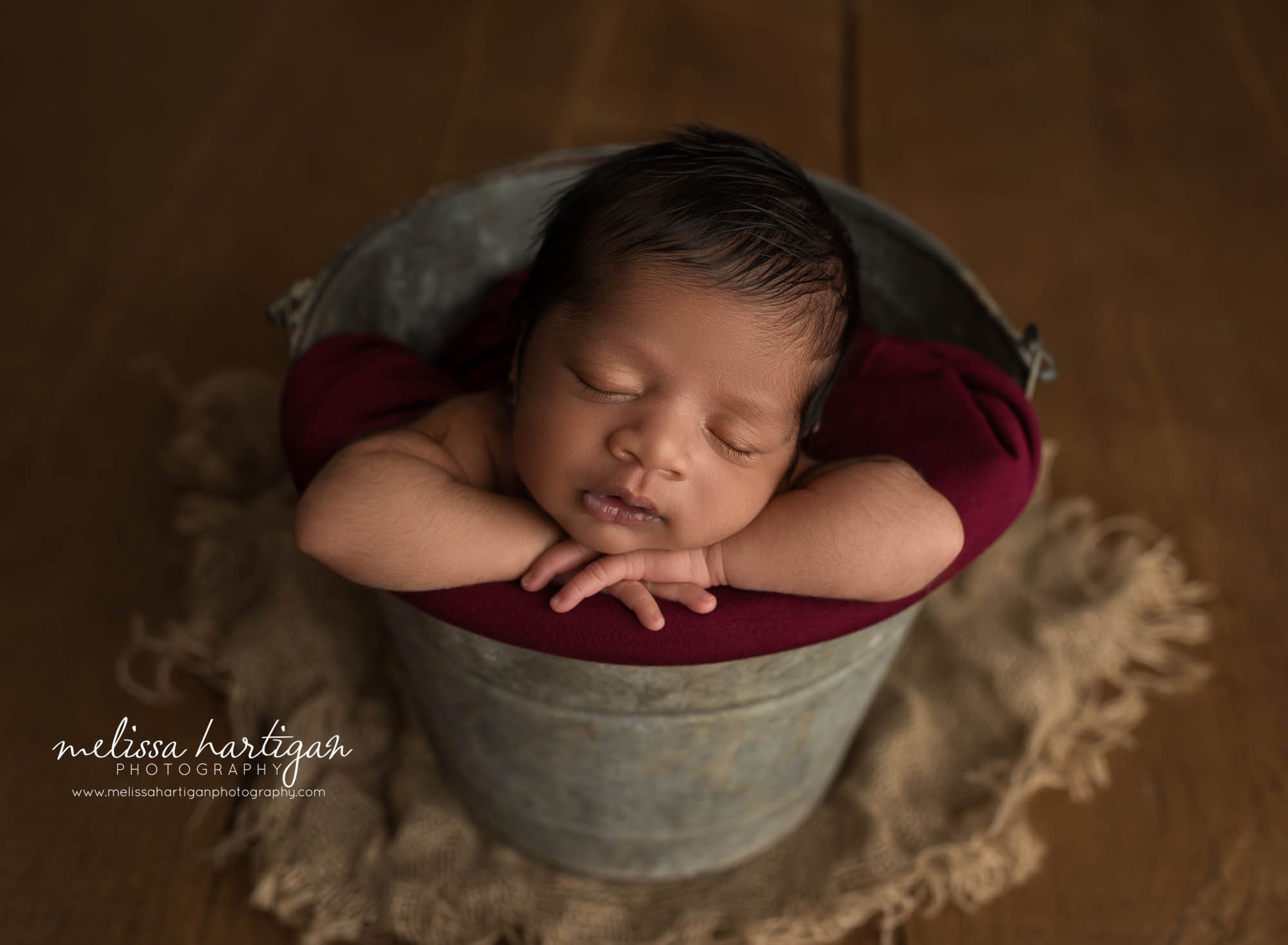 newborn baby boy posed in bucket connecticut newborn photography