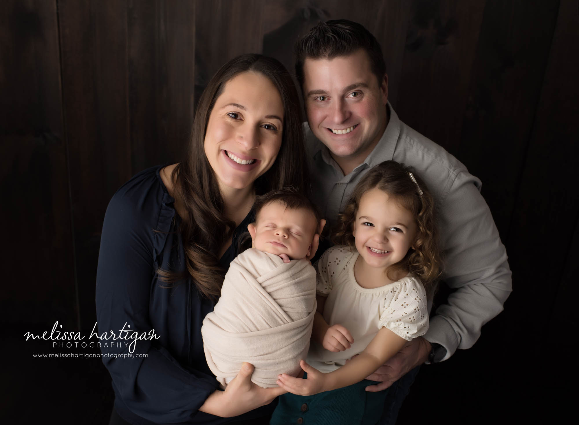 mom dad big sister and newborn baby boy wrapped for family photo pose newington ct newborn photographer