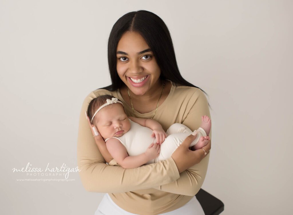 big sister holding newborn sister in sibling pose south windsor ct newborn photography