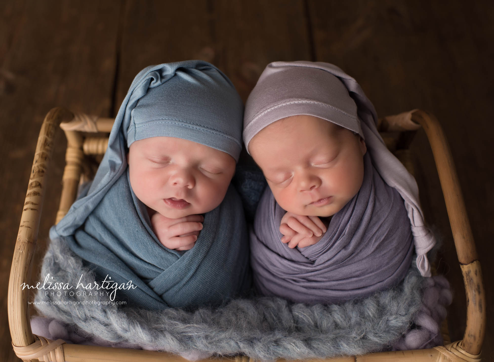 newborn babies boy girl twins posed together in basket
