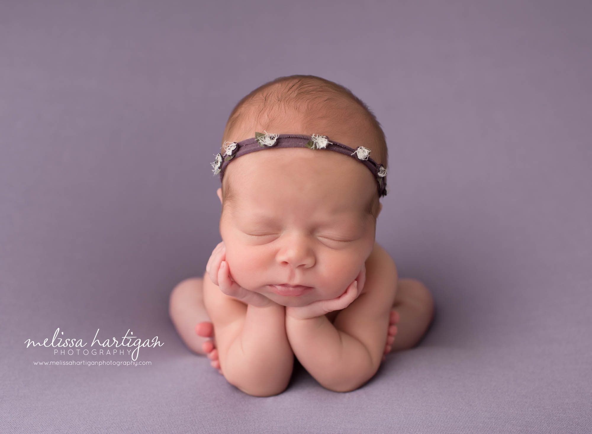 newborn baby girl posed froggy pose on purple backdrop CT twin newborn photography