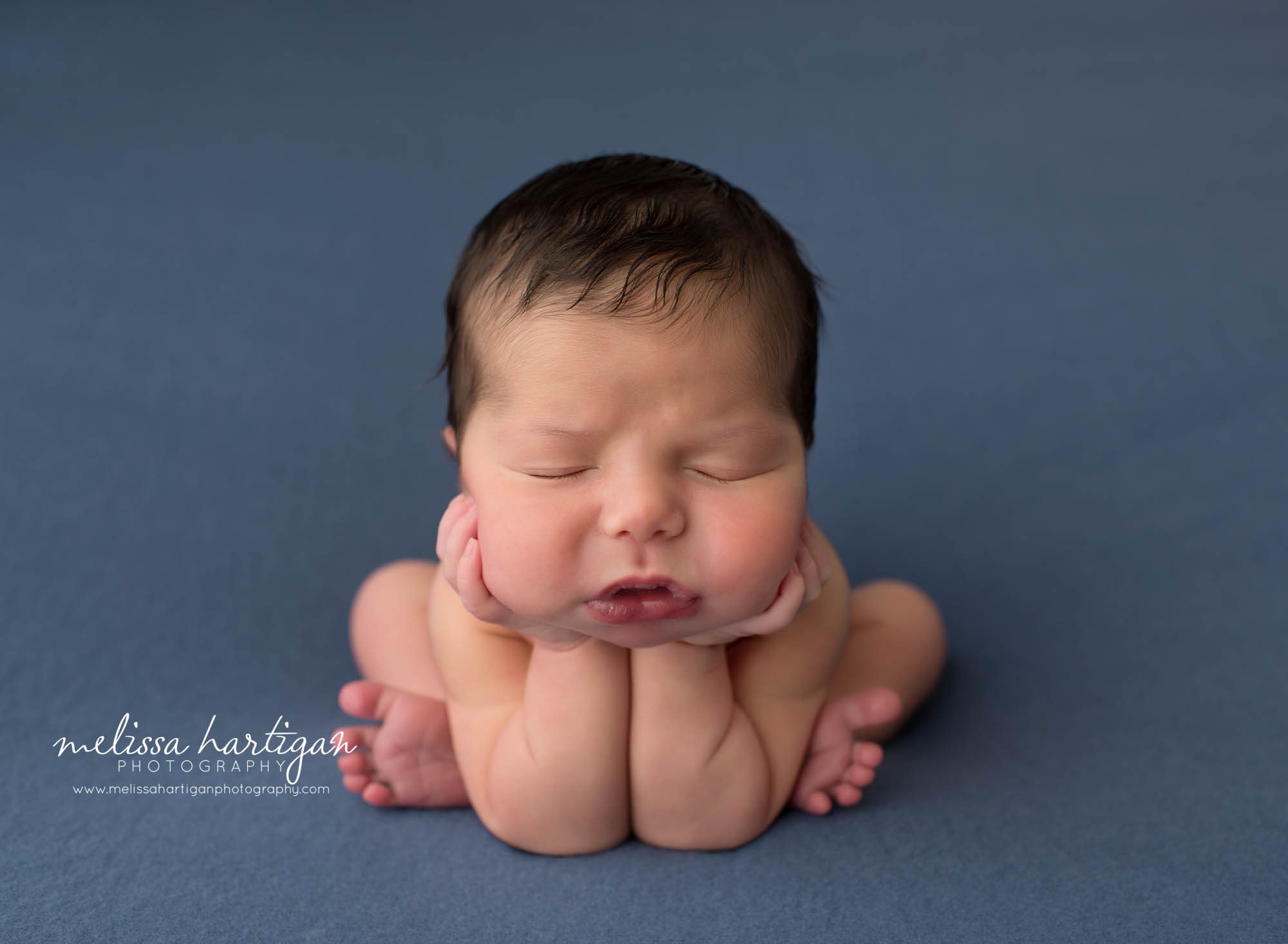 Newborn baby boy posed froggy pose