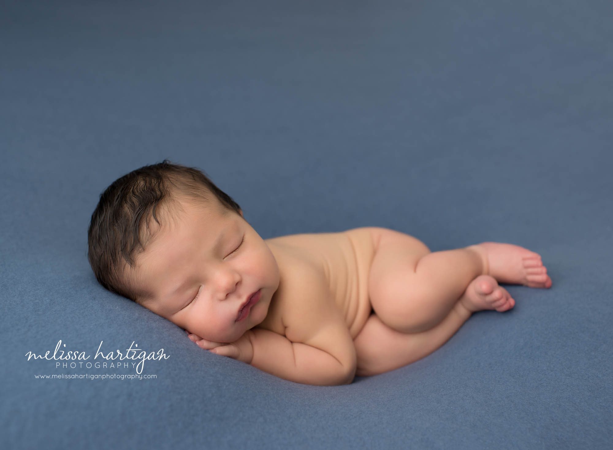 Newborn baby boy posed sleeping on side with hand under cheek south windsor CT newborn photography