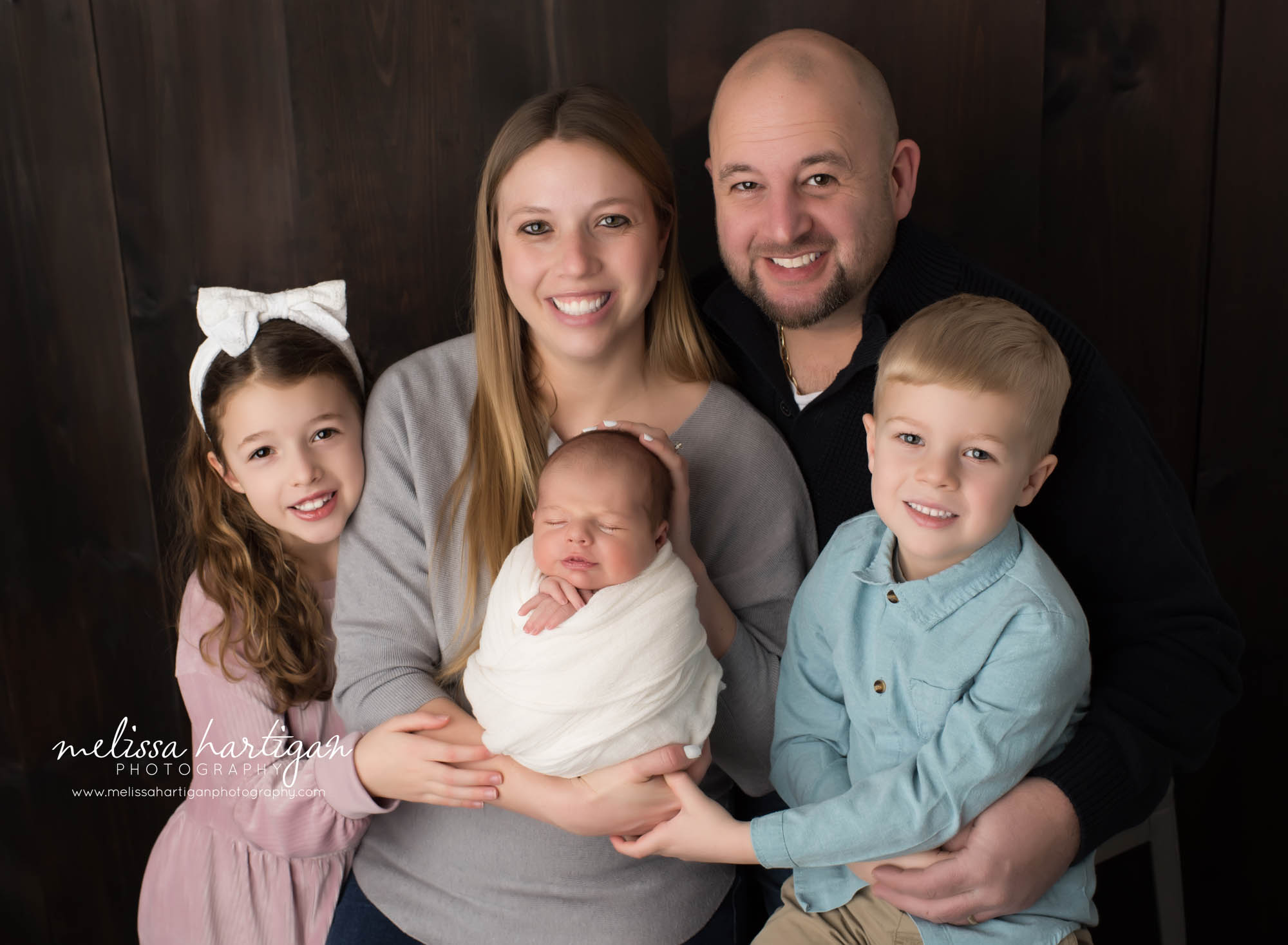 family pose with mom dad two older siblings and newborn baby boy Wethersfield CT Newborn photography