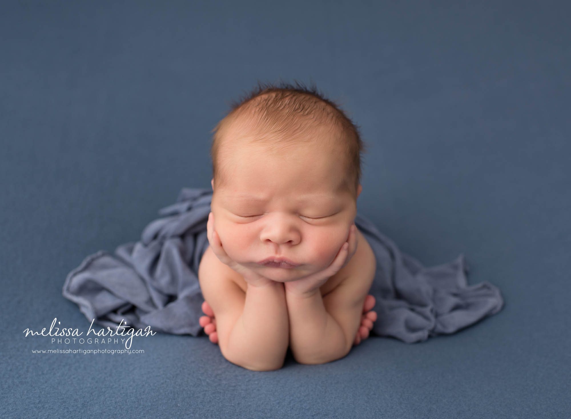 Newborn baby boy posed froggy pose