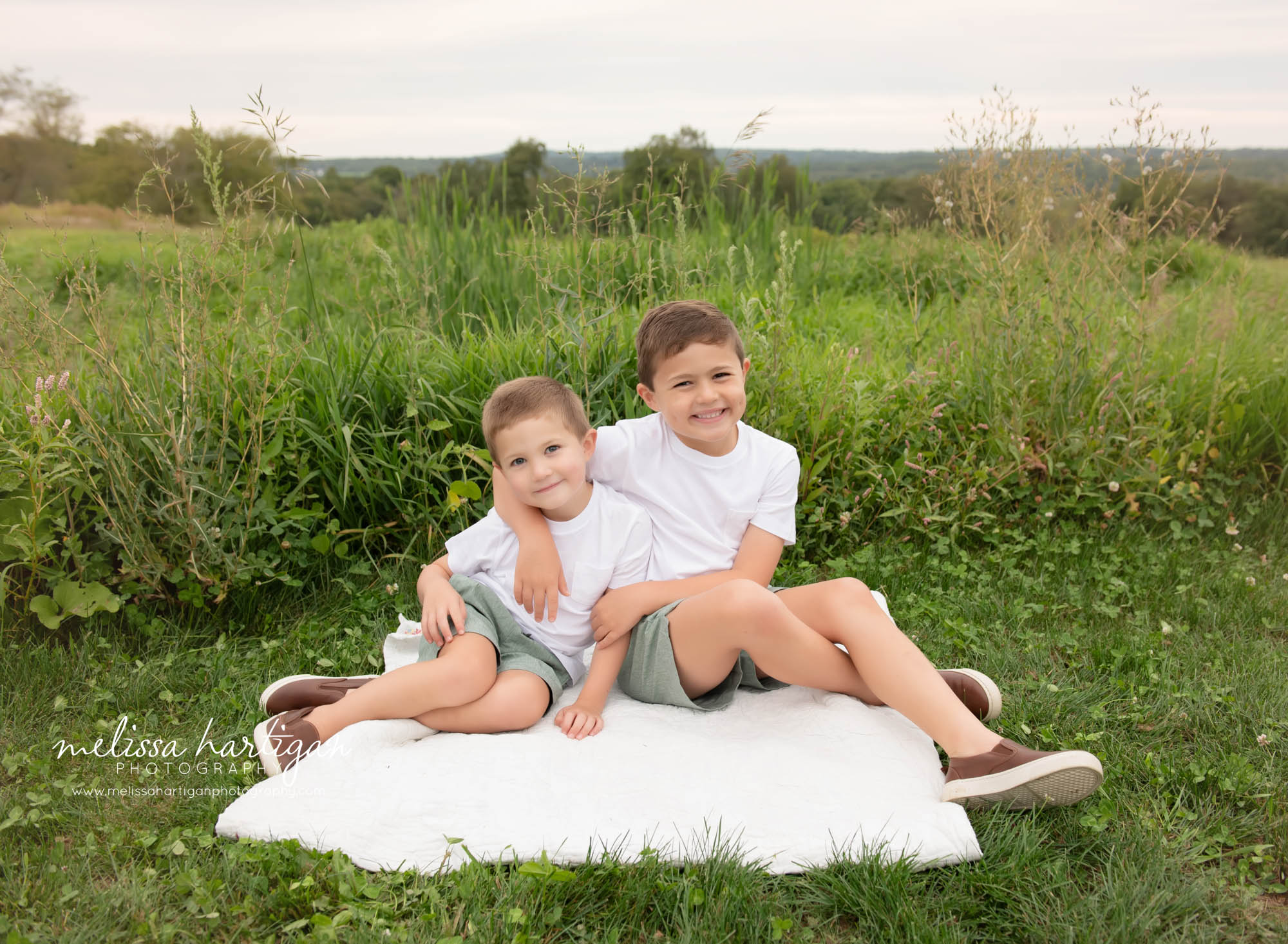 Two brothers sitting happy smiling Ellington CT Family Photography