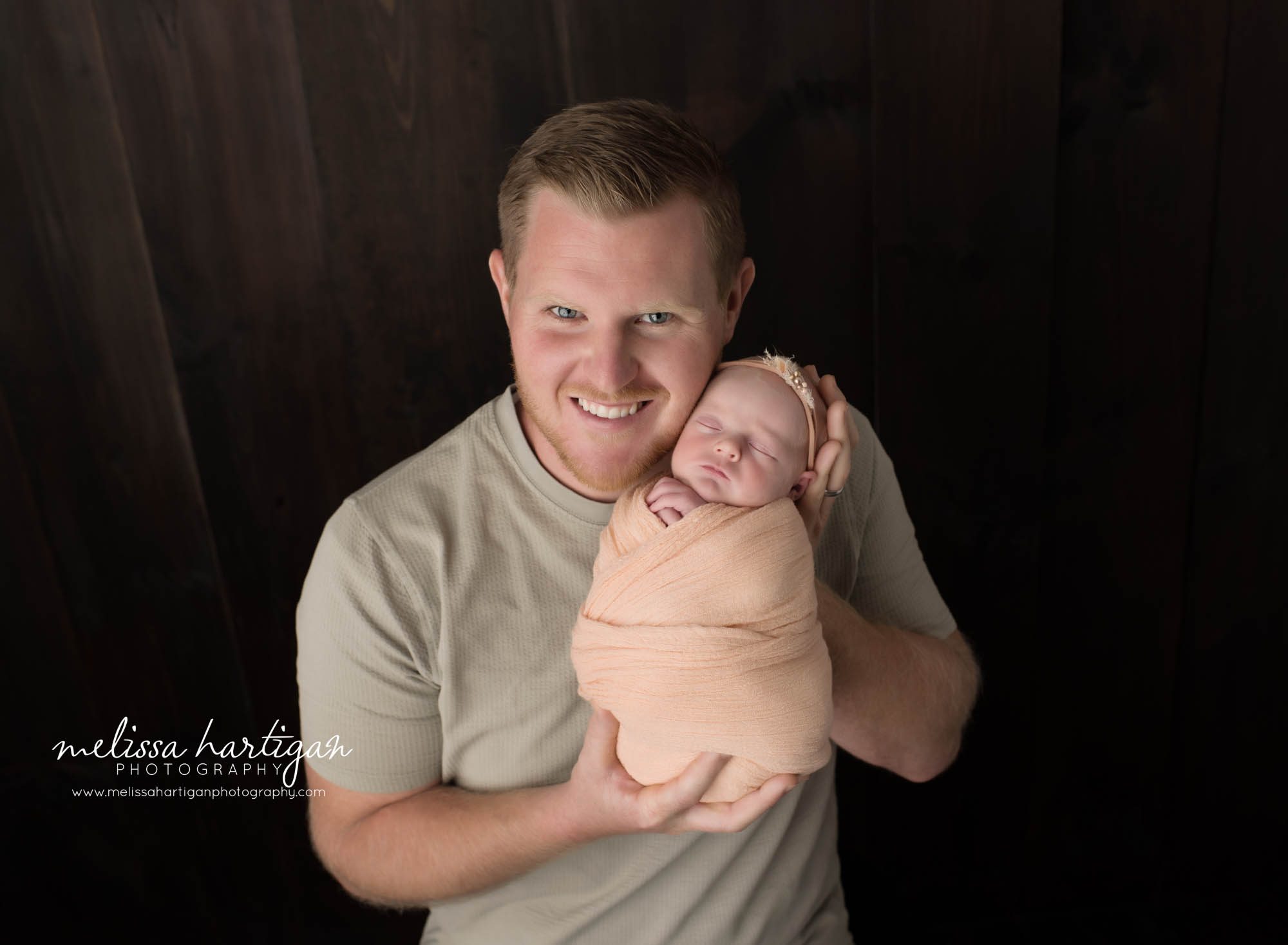 dad holding baby daughter