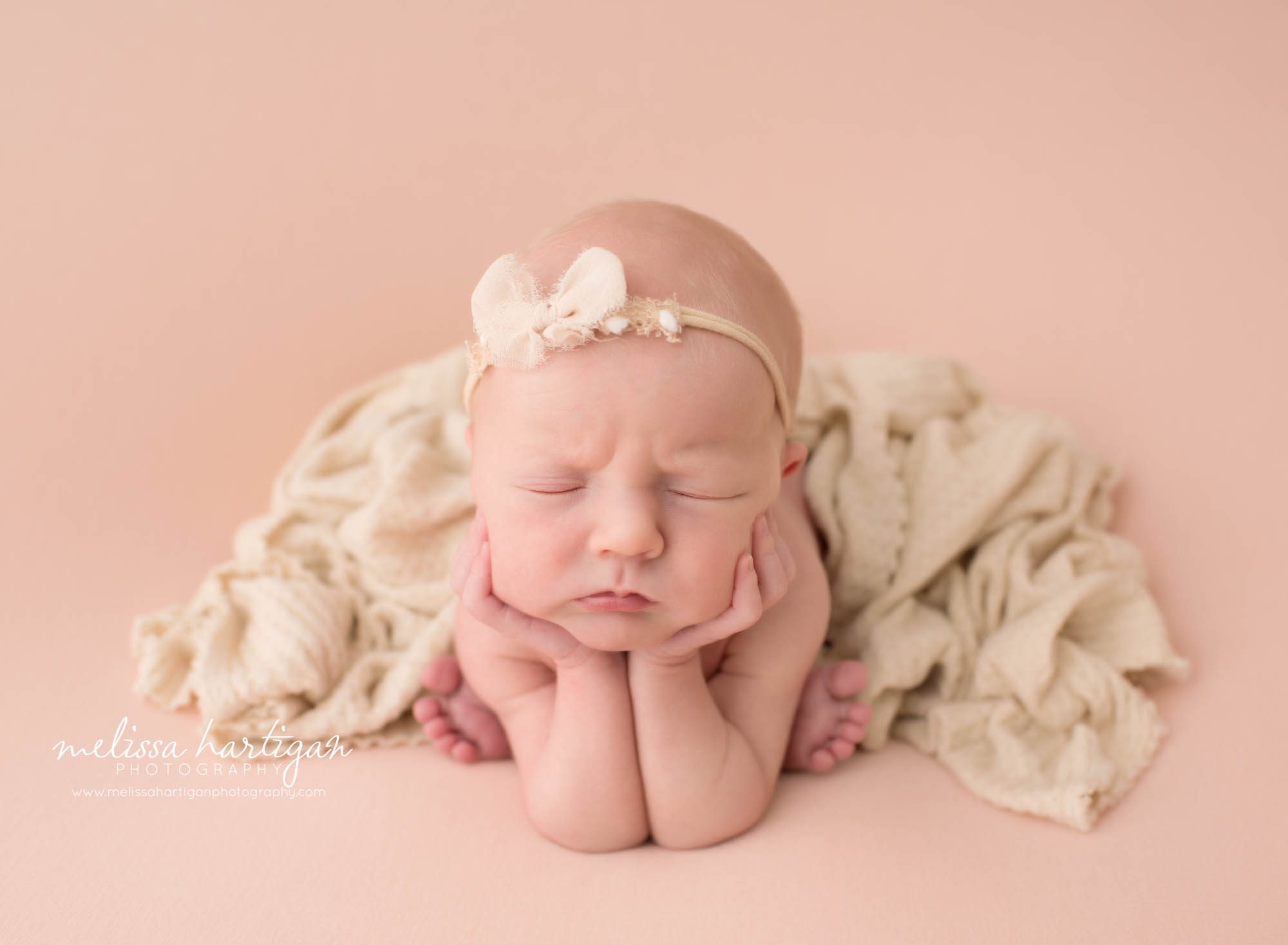 newborn baby girl posed froggy pose on pink backdrop Stafford Springs Baby Photography