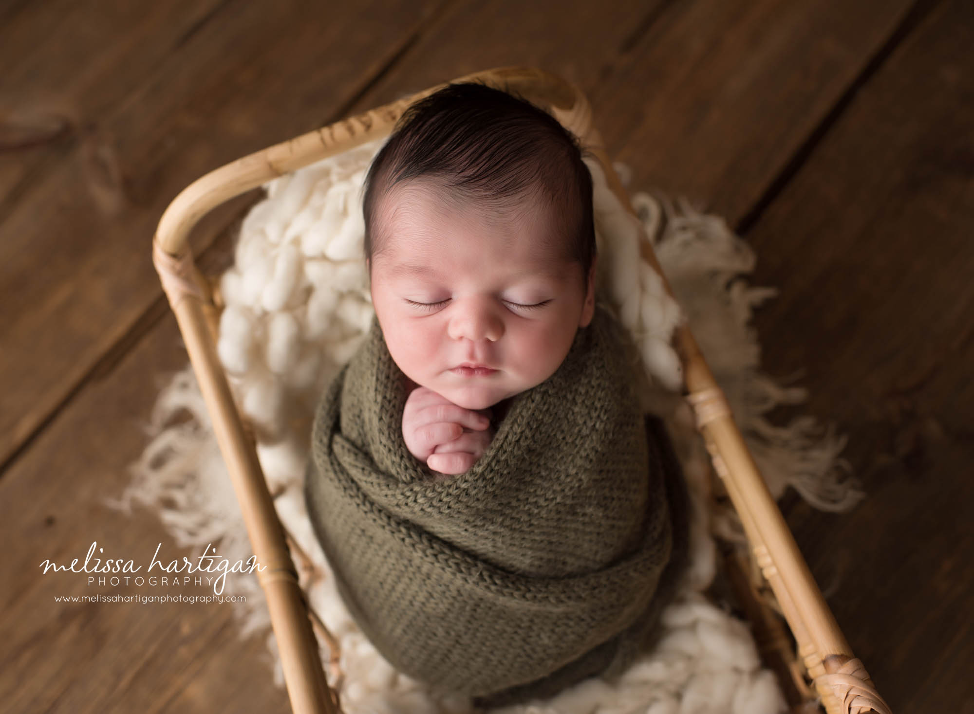 newborn baby boy posed in basket