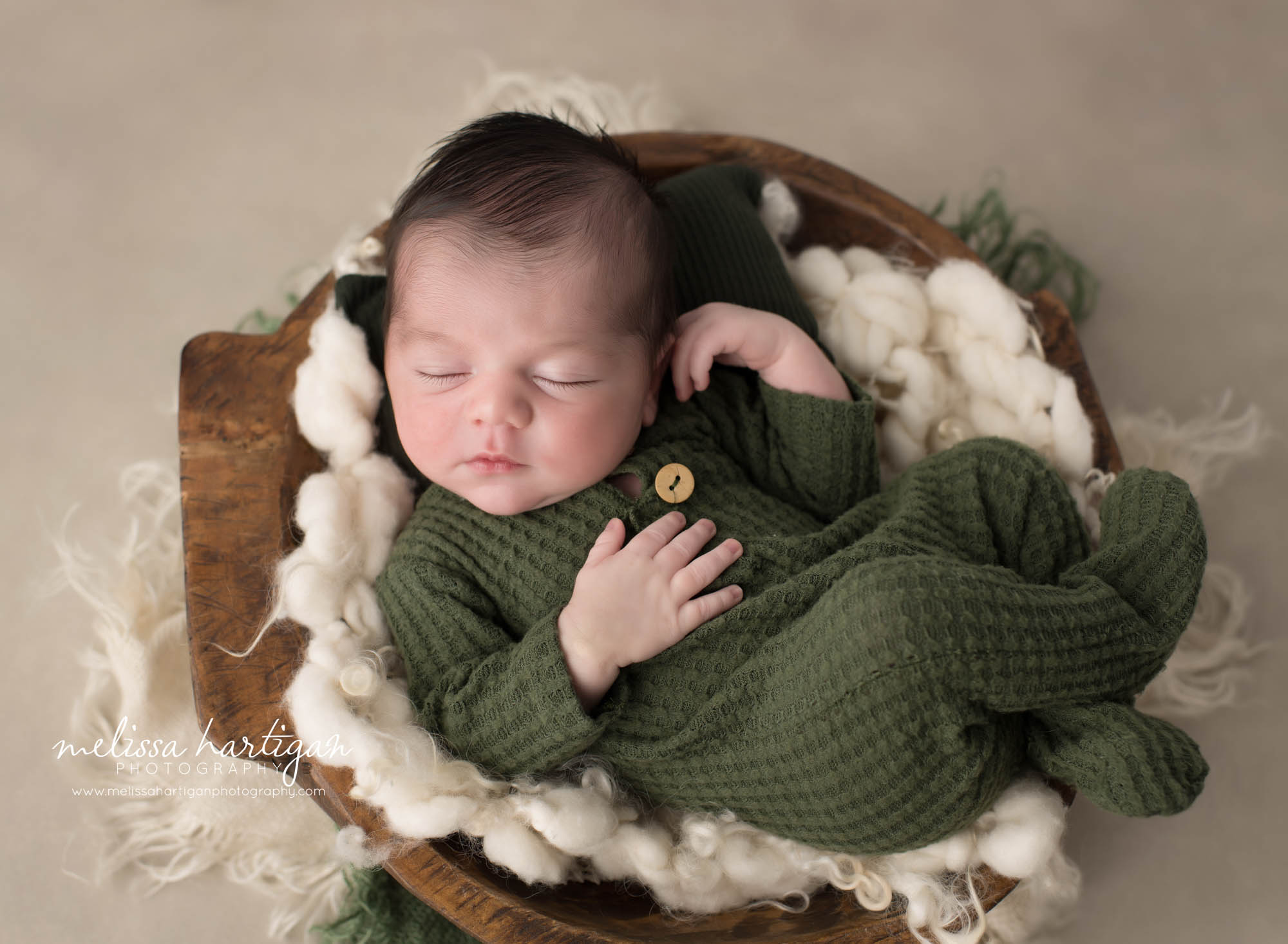 Newborn baby boy posed in wooden bowl prop Newborn Photography Ellington CT