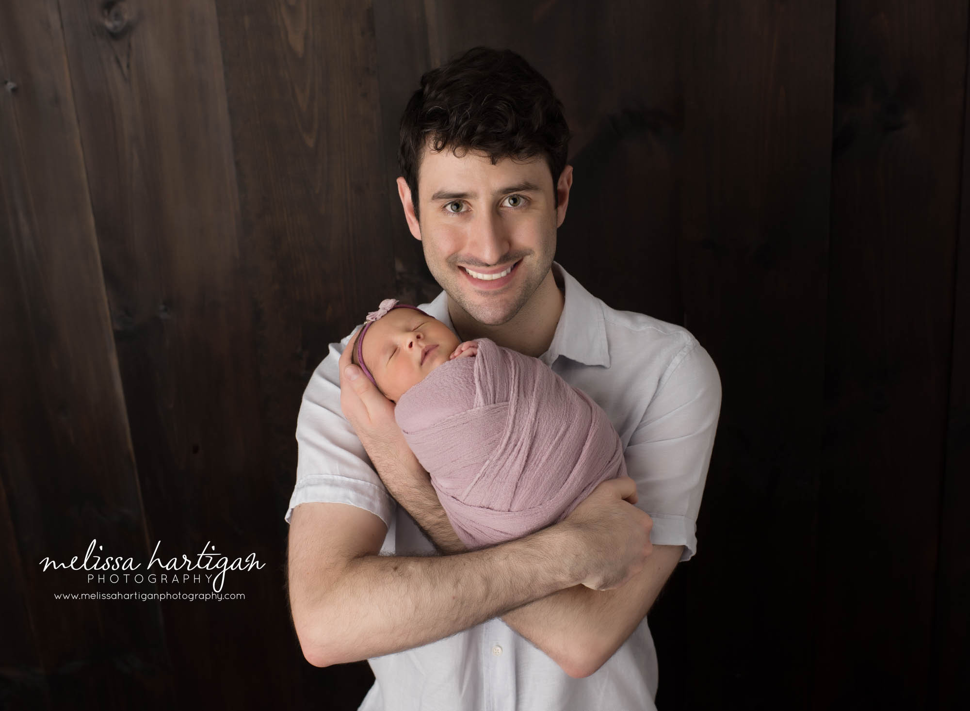 dad holding baby girl