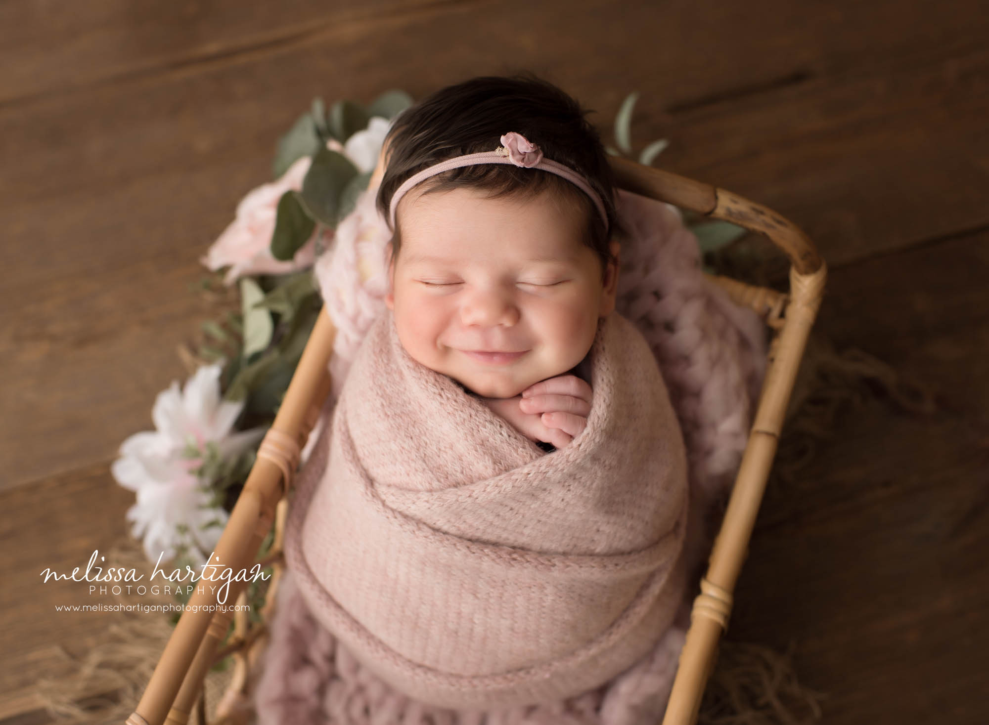 Newborn abby girl smiling posed in basket Newborn Photography Farmington CT