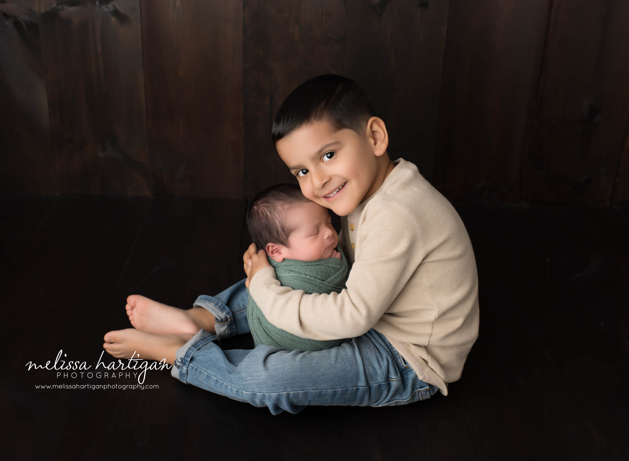 big brother holding newborn baby brother Manchester CT Newborn Photography