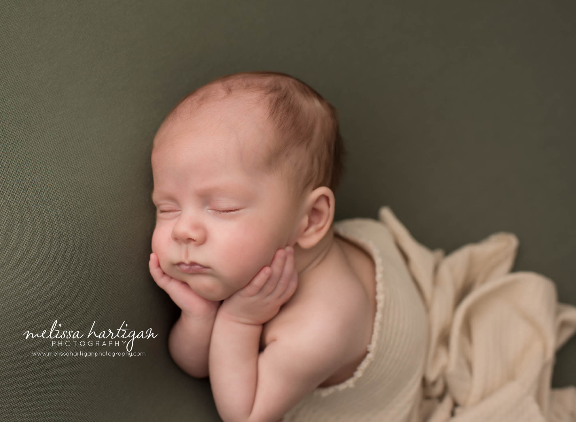 newborn baby boy posed with hands holding cheeks Willington CT Newborn Photography