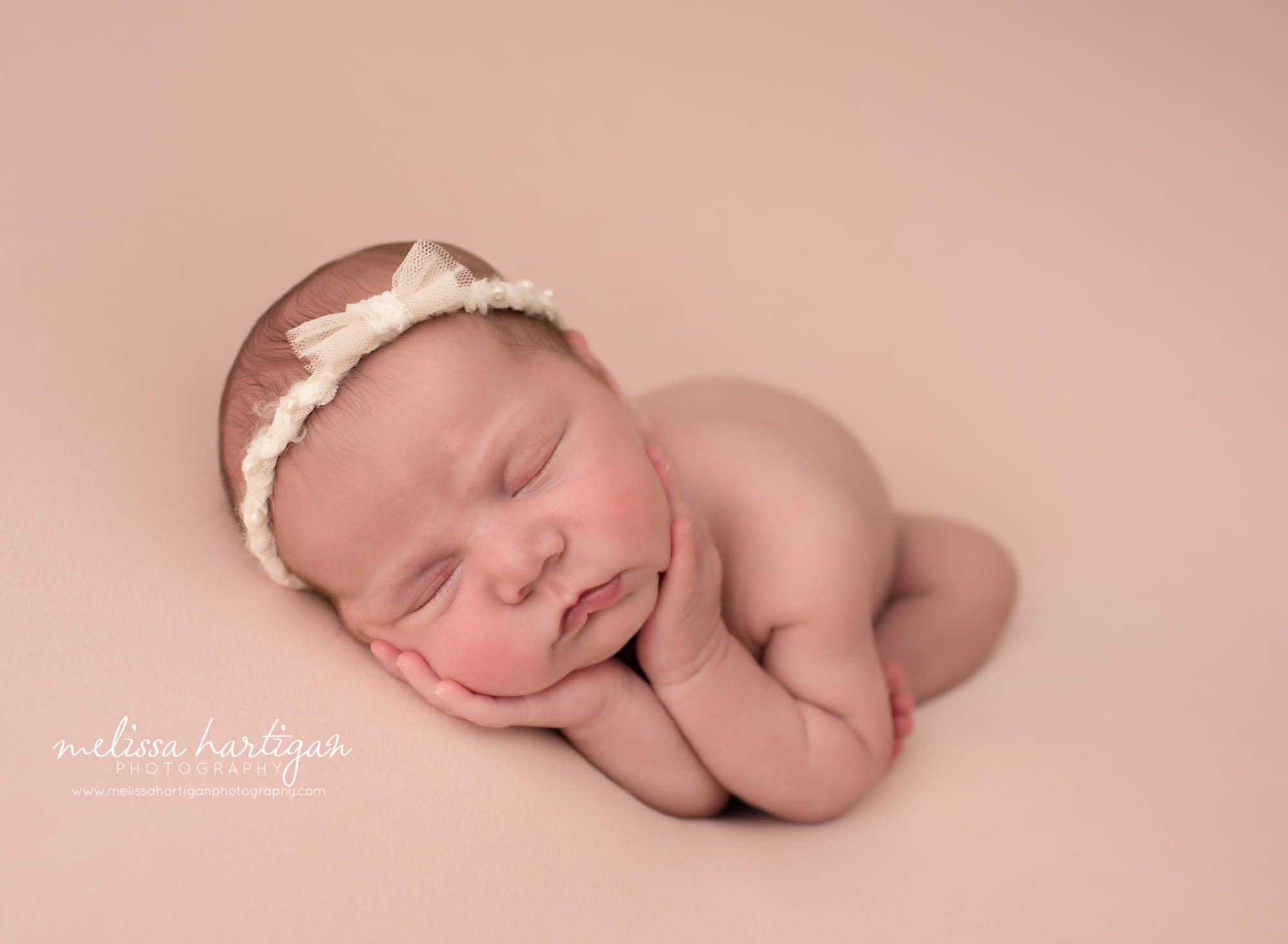Newborn baby girl posed timber pose in newborn studio photoshoot