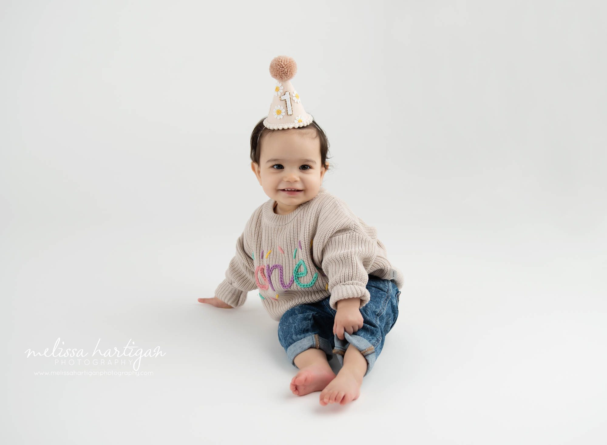 Baby girl wearing birthday hat posing Baby Photography Bloomfield CT