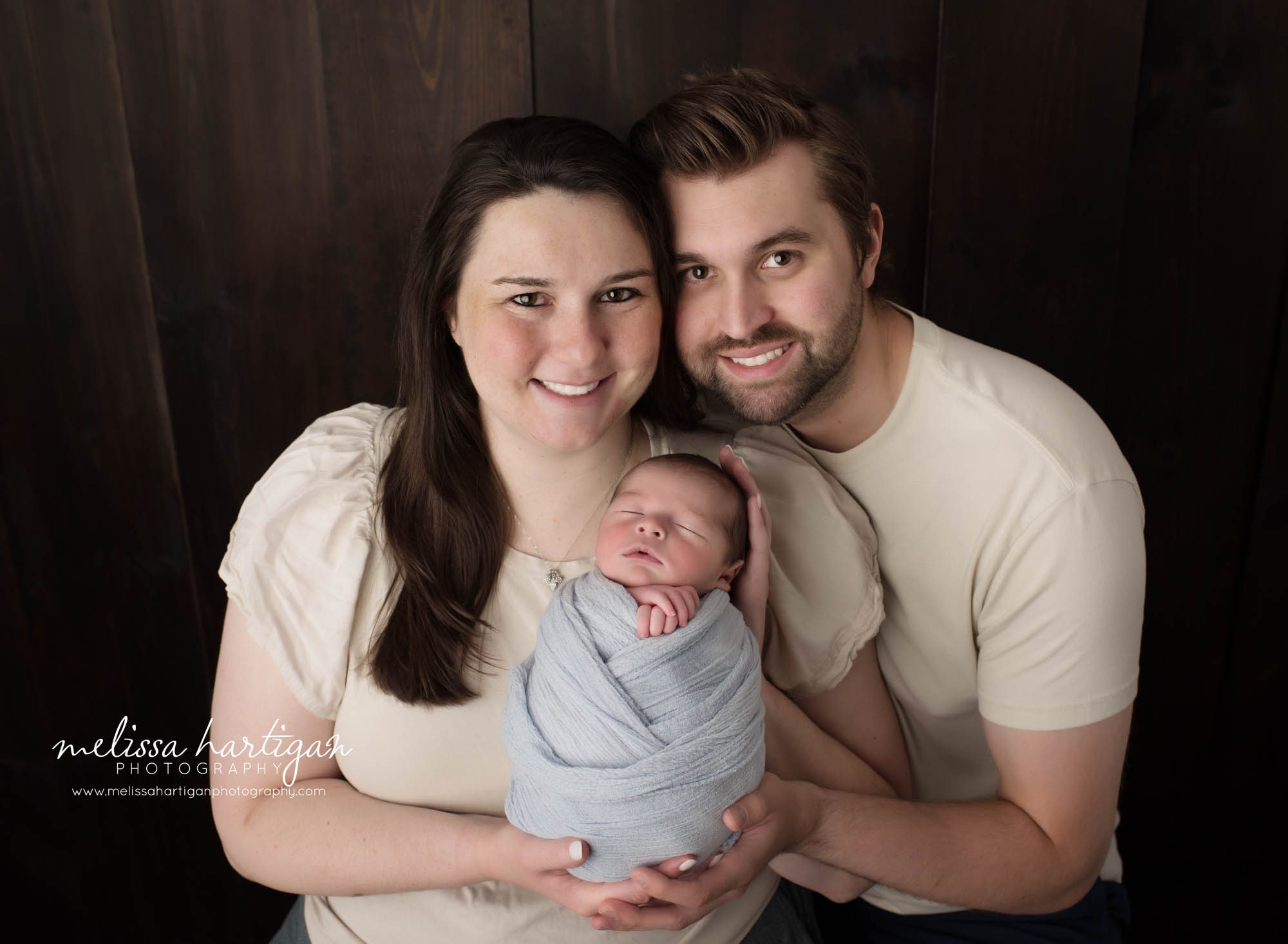 Mom dad and newborn son posing for family pose Newborn Photography Hebron CT