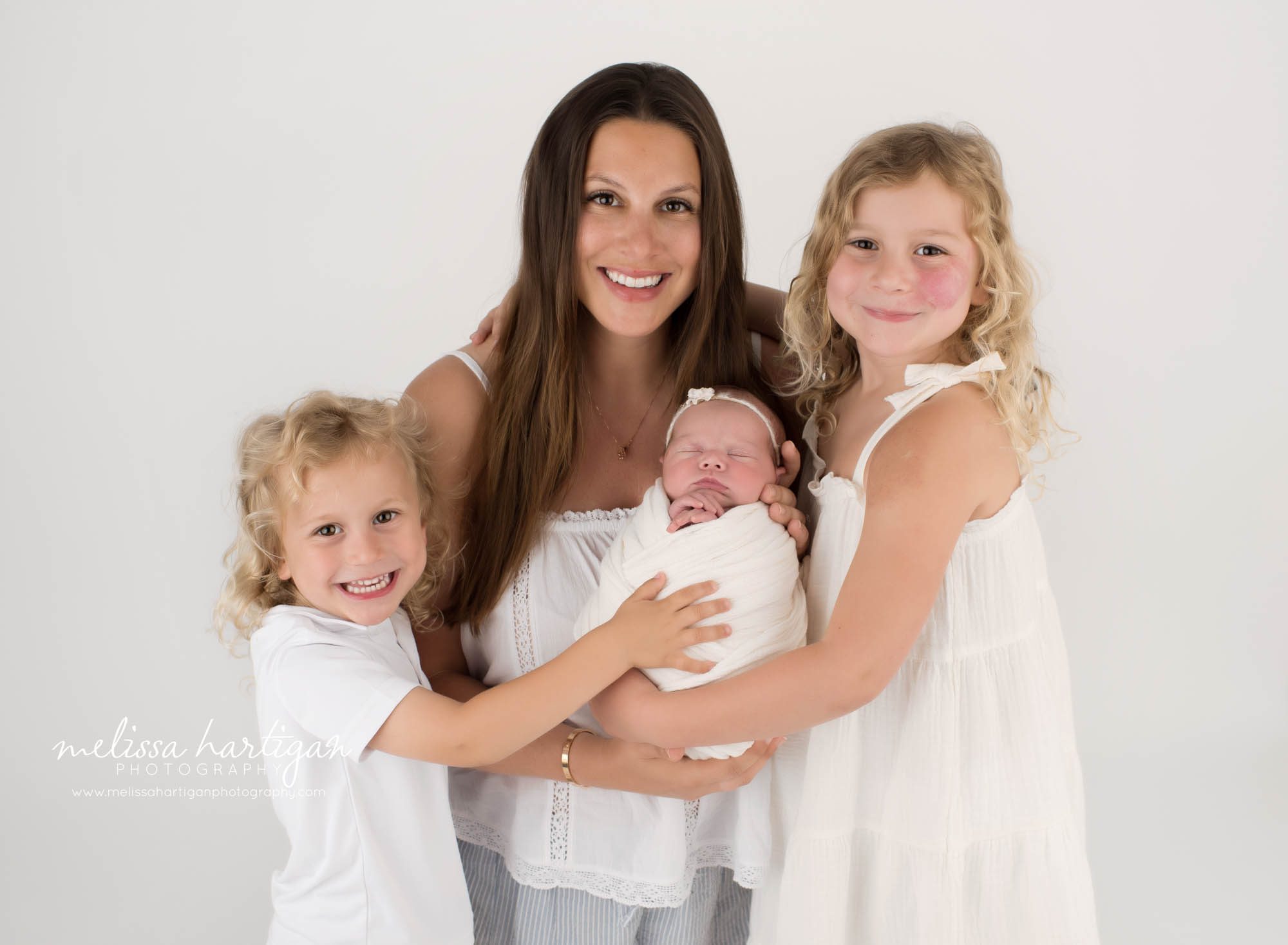 Mom big sister big brother and newborn baby daughter posed together for family pose Newborn Photography Ivoryton CT