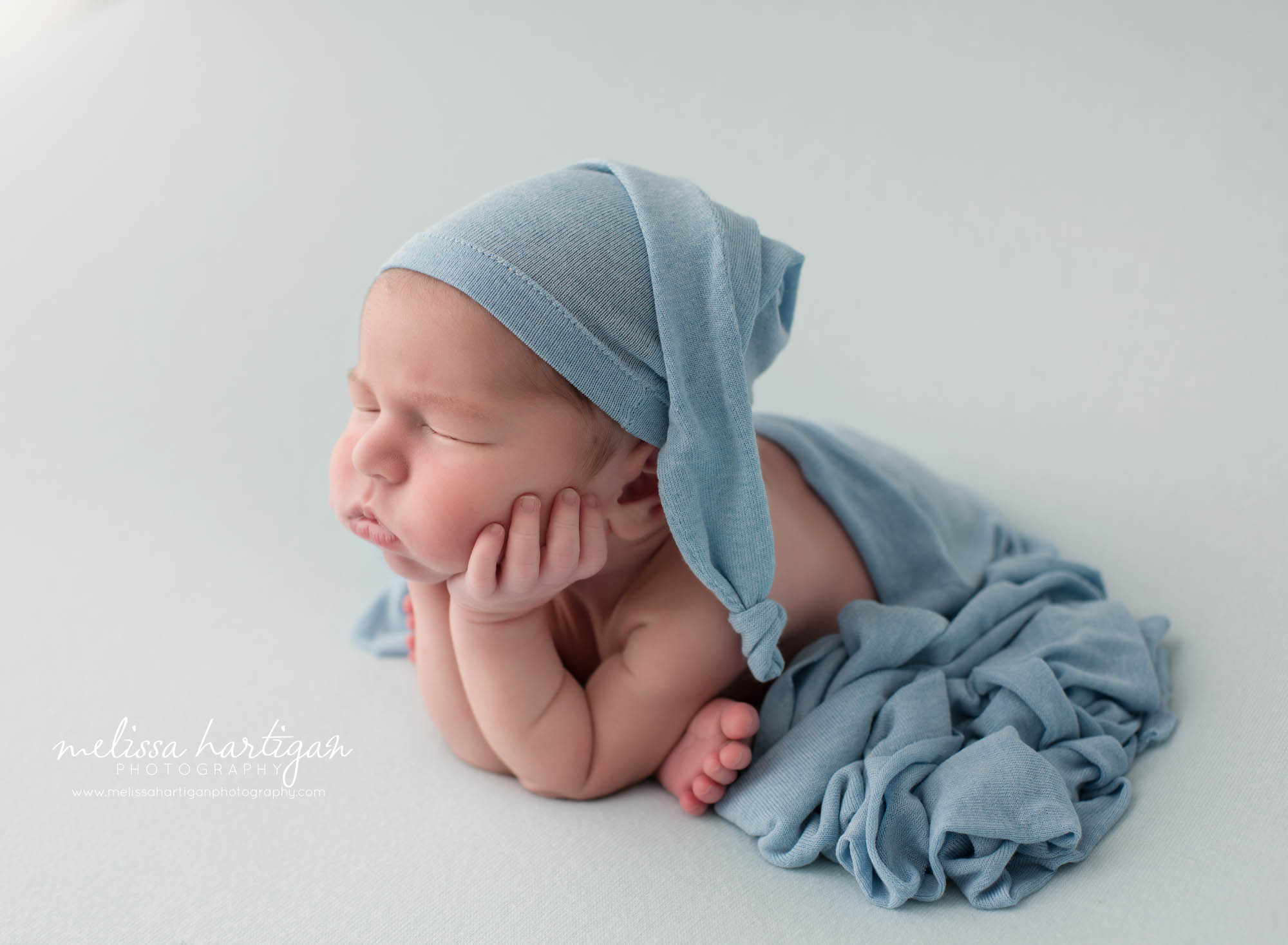 Newborn baby boy posed froggy pose side profile Newborn Photography Hebron CT