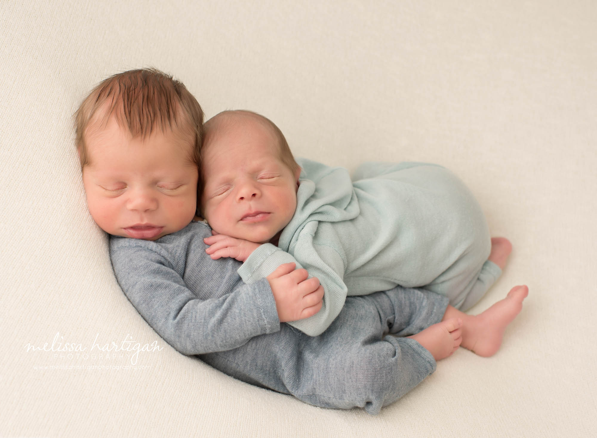 Twin boys posed together sleeping Colchester CT Newborn Photography