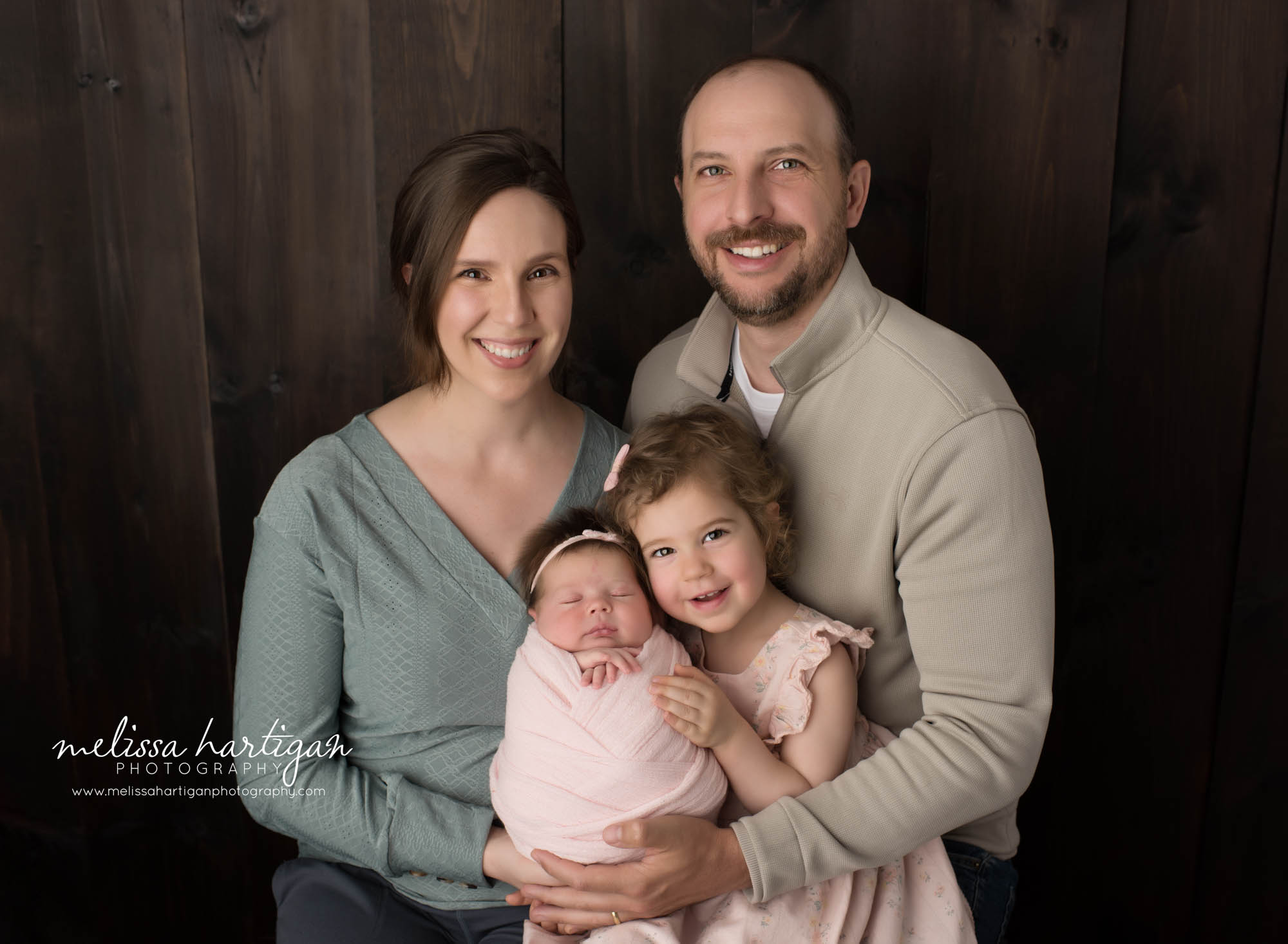 Mom dad big sister and newborn baby girl posed together for family pose Hebron CT Newborn Photography