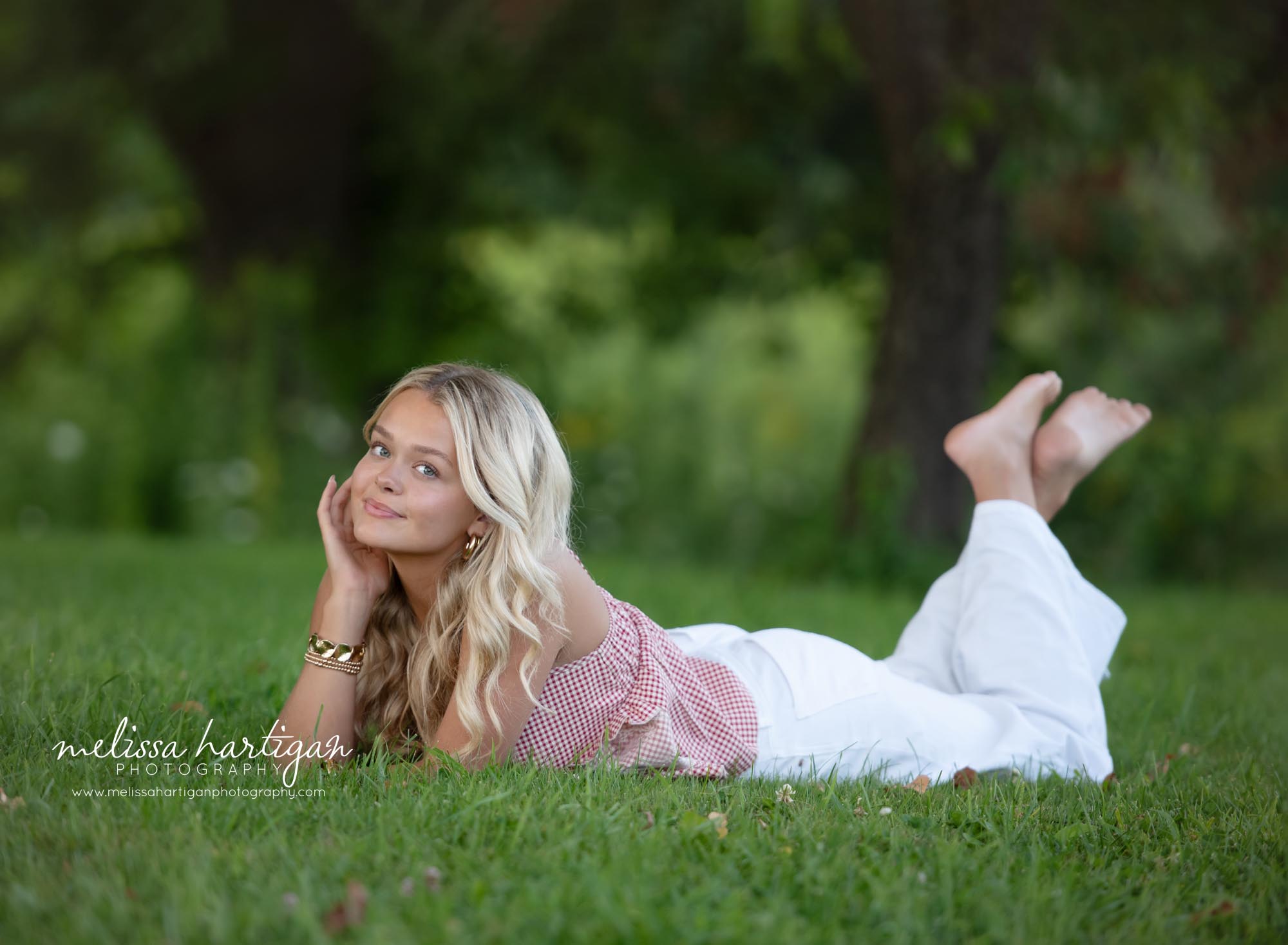 high school senior laying on grass pose Coventry CT Senior Photography
