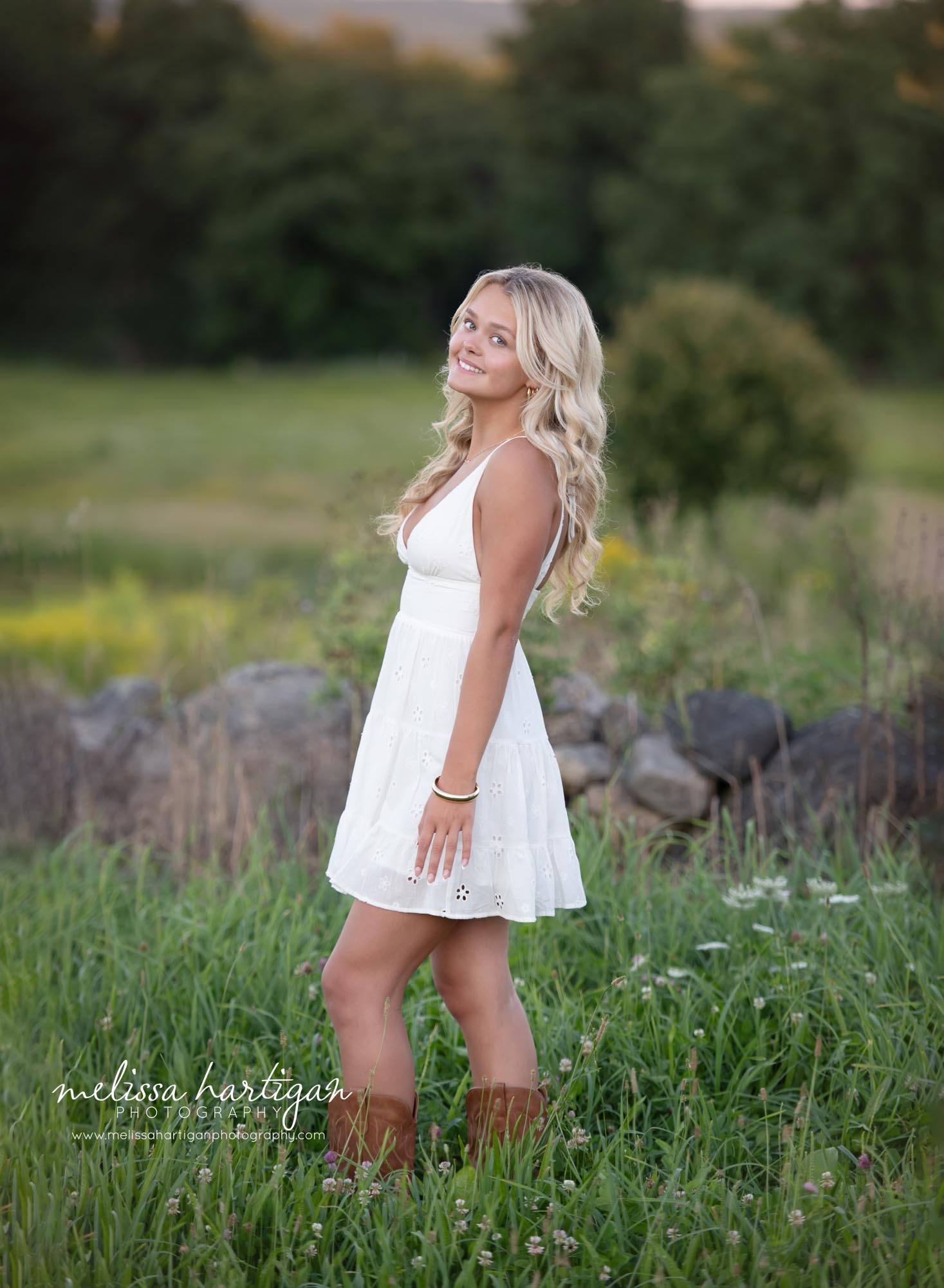 Girl standing in grass smiling and posing Coventry CT Senior Photography