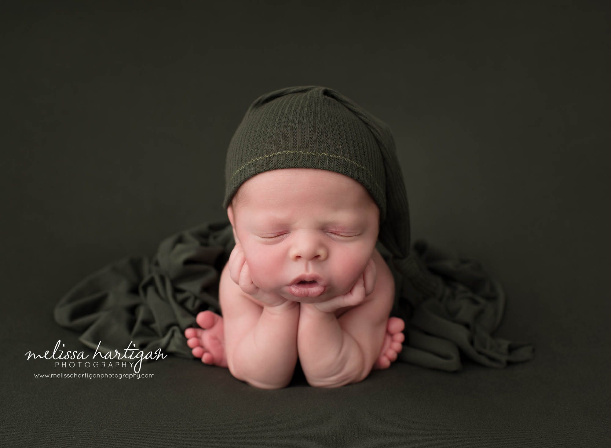 Newborn baby boy posed froggy pose